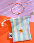 Perlenarmband Smile mit Säckchen, orange-rosa