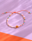 Perlenarmband Smile mit Säckchen, orange-rosa