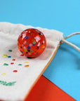 Supermurmel im Stoffbeutel mit Stick, orange